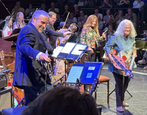 Joellen Lapidus on the right, leaving the stage after her surprise performance. Photo by Karen Salkin.